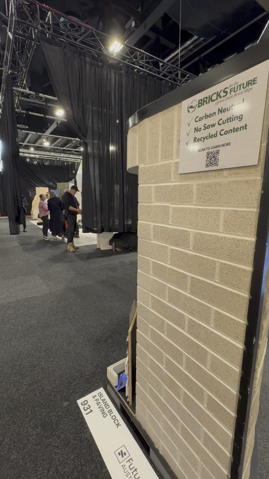Bricks For The Future sustainability signage on the Krause Bricks stand at Futurebuild 2026, highlighting carbon neutral, no saw cutting and recycled content for Nexbrick facades.