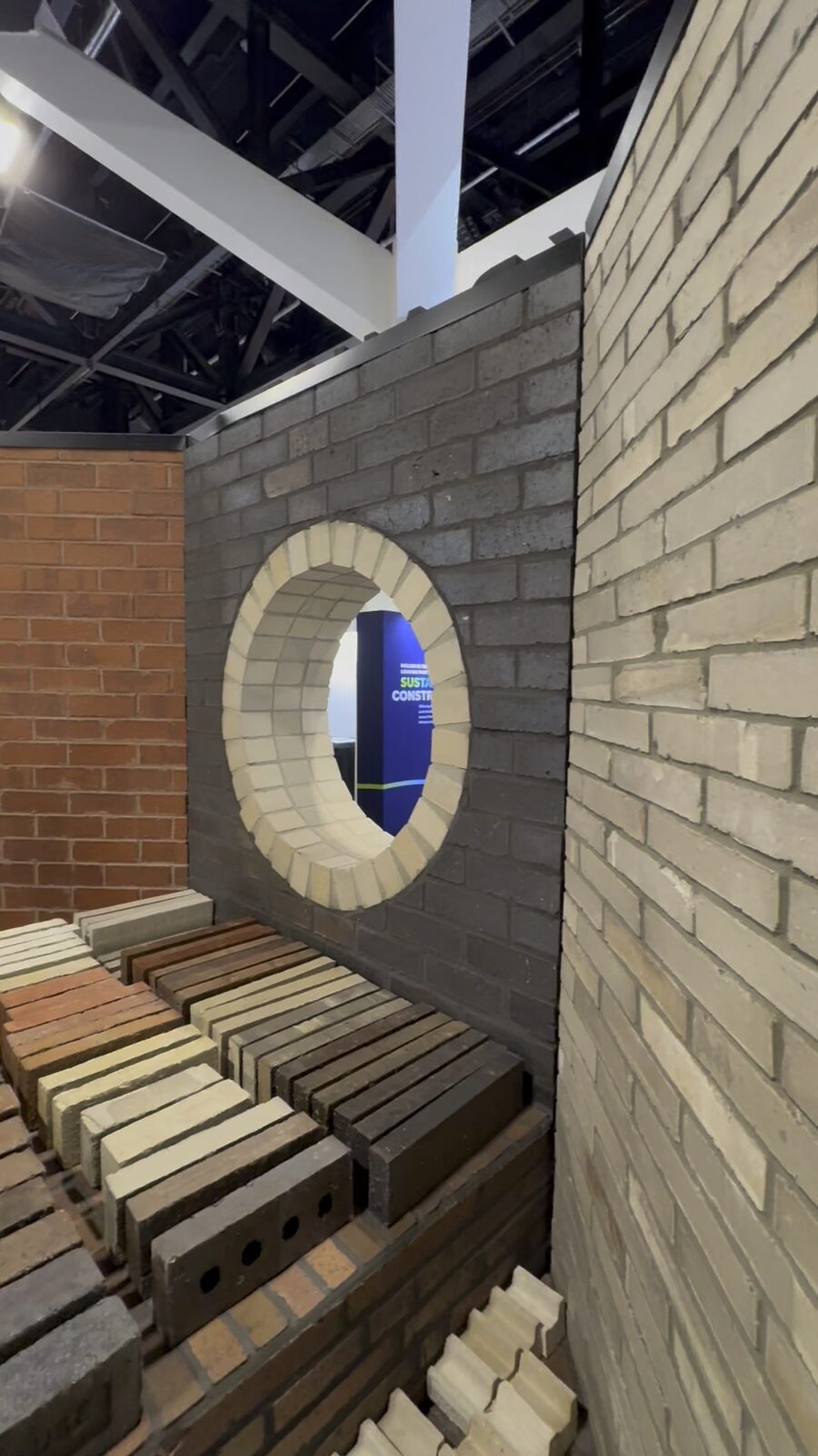 Krause Bricks exhibition stand at Futurebuild Australia 2026, showing a Nexbrick brick-facade feature wall with a circular brick arch and brick samples.